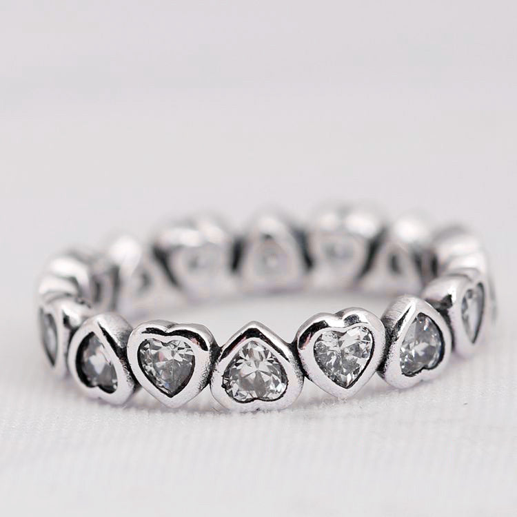 Elegant silver heart diamond ring featuring heart-shaped diamonds for a romantic touch