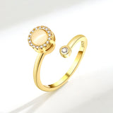 Elegant gold simple ring for women with a central stone and sparkling accents