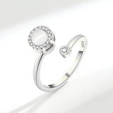 Simple ring for women in silver with a round gemstone and decorative stones