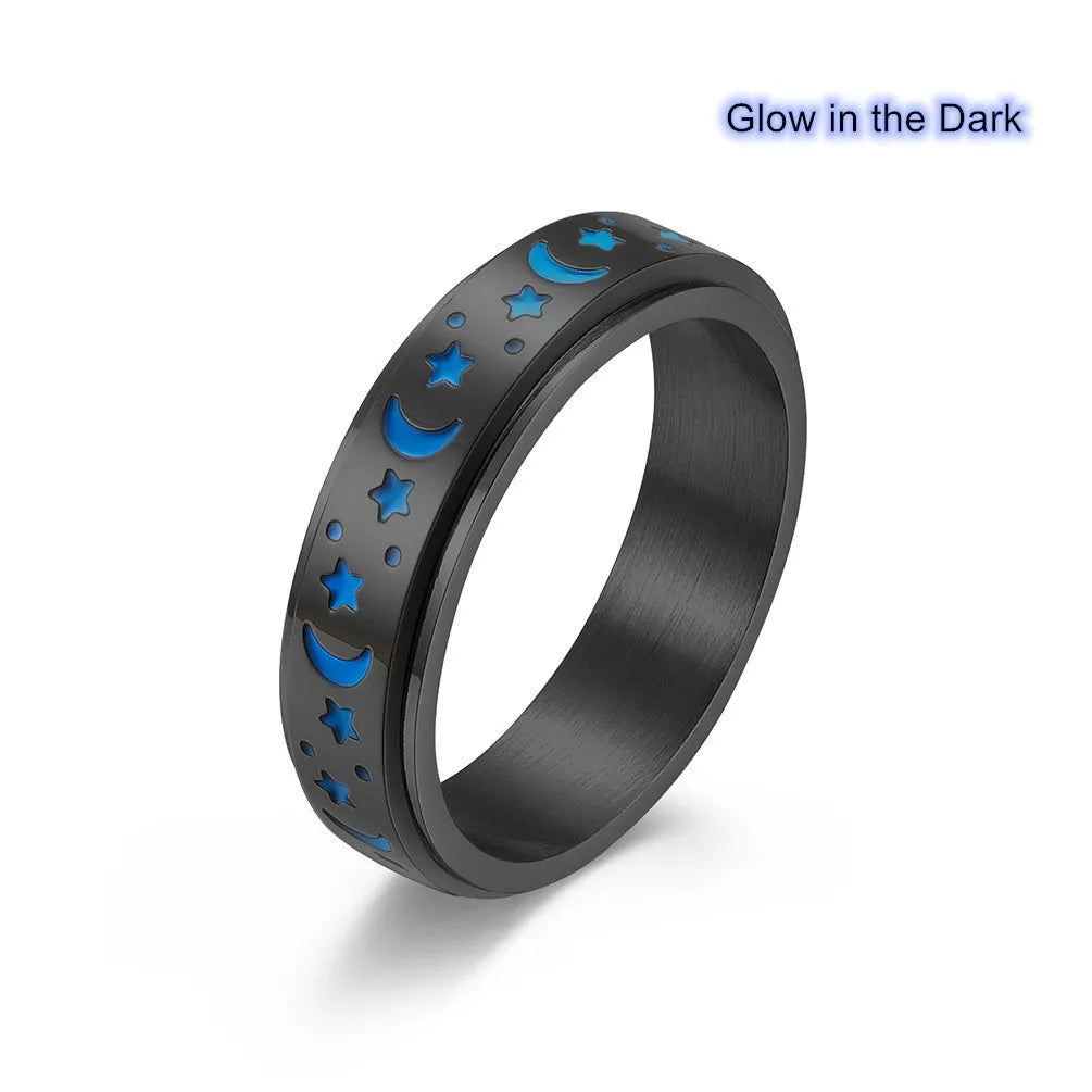stainless steel star spinner ring featuring glow in the dark moons and stars design