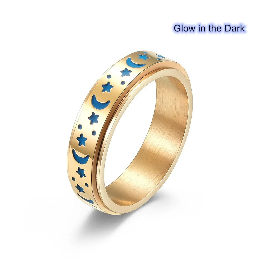 Gold stainless steel star spinner ring featuring glow-in-the-dark moon and star design for stylish accessories