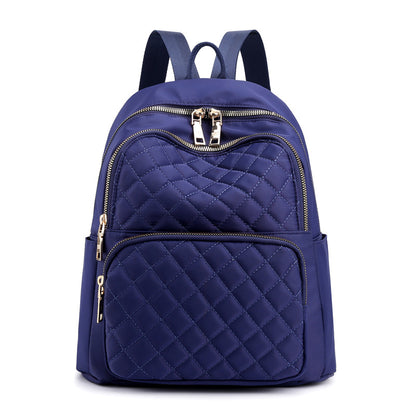 navy quilted stylish everyday women's backpack with multiple zippered compartments