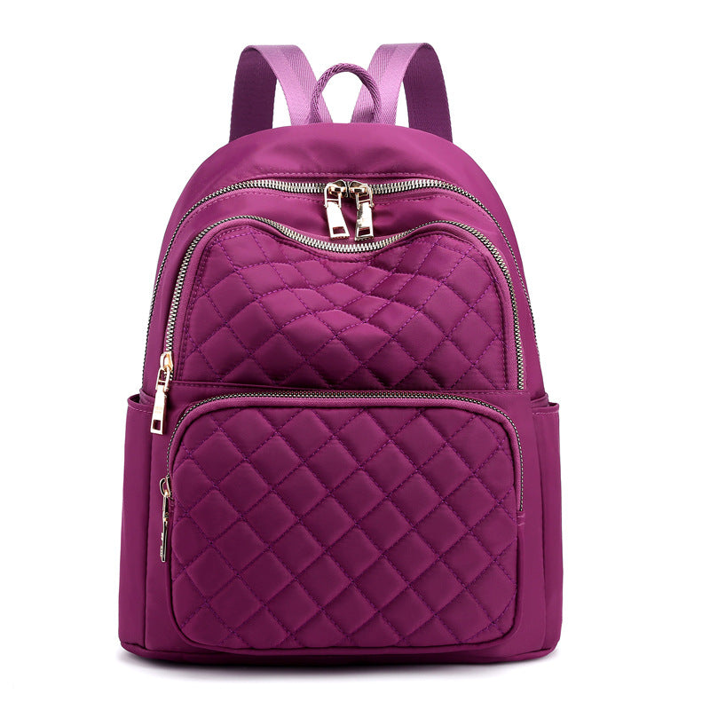 purple stylish everyday women's backpack with quilted design and multiple zippered compartments