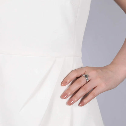 Elegant hand wearing a 925 sterling silver Irish promise ring for women with a floral design