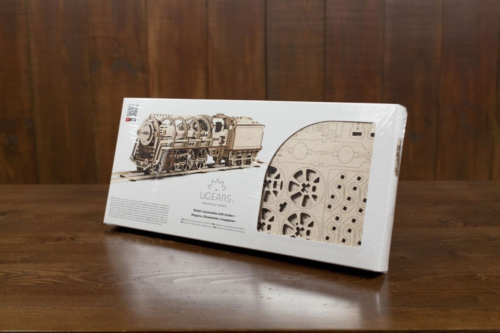 mechanical locomotive model kit box featuring intricate wood pieces for assembly and detailed design