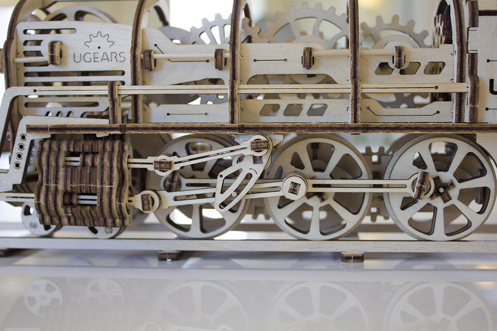 mechanical locomotive model kit with detailed gears and wheels showcasing intricate design