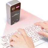 bluetooth wireless laser keyboard projecting full QWERTY onto a tabletop with hands typing
