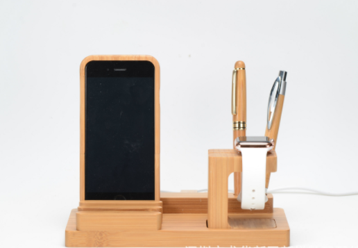 CJD iPhone case on a universal wood charging station with a pen and smartwatch holder