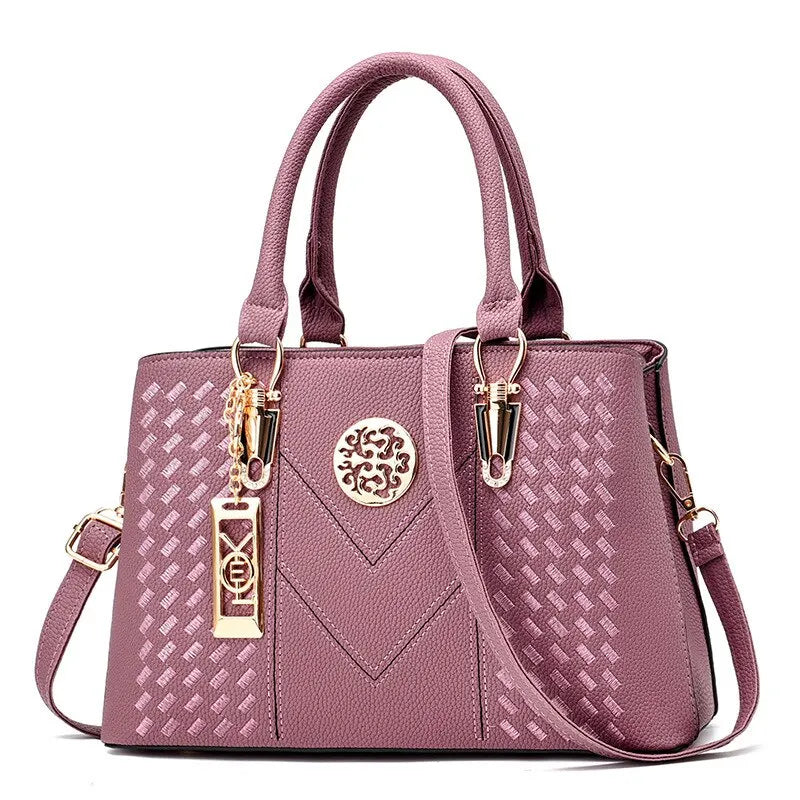 Stylish Dsers business messenger shoulder bag for women in pink with elegant detailing and adjustable strap