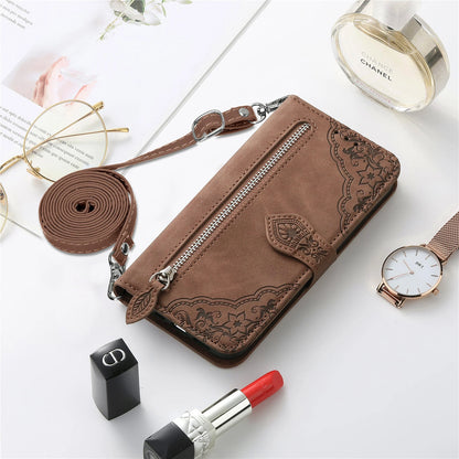 Stylish wallet case for iPhone 14 13 12 with strap, featuring intricate floral design and a convenient zip pocket