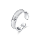 women's diamond adjustable ring with elegant textured band and sparkling diamond accent