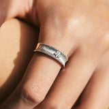 Stylish women's diamond adjustable ring with detailed silver design on a hand