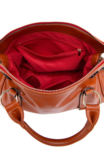 Interior view of women's PU leather laptop handbag showing red lining and multiple pockets