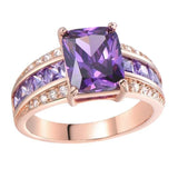 Stunning women's retro blue fashion ring featuring a large purple stone and sparkling accents