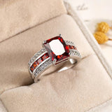 Stunning women's retro blue fashion ring with vibrant red stones and silver accents for stylish outfits